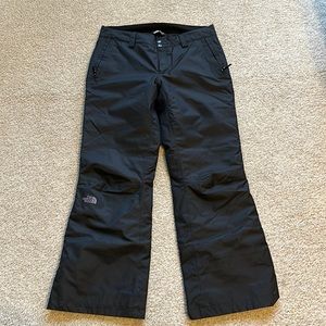 Size L women’s North Face black snowboard pants.